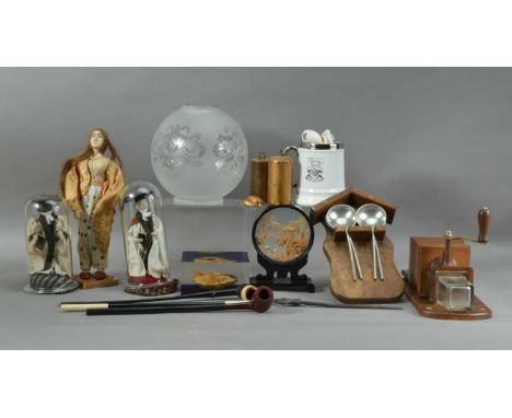 An assorted collection of works of art,  including two 'university graduate' dolls, both 18cm high, another doll 31cm high, a