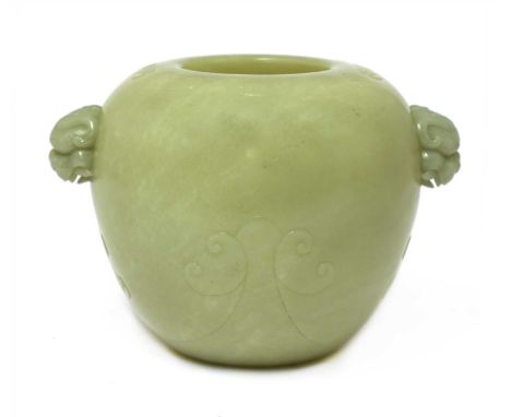 A Chinese jade jar, of globular form with an inverted rim carved with scrolls, Buddhist lion handles, 14cm wide