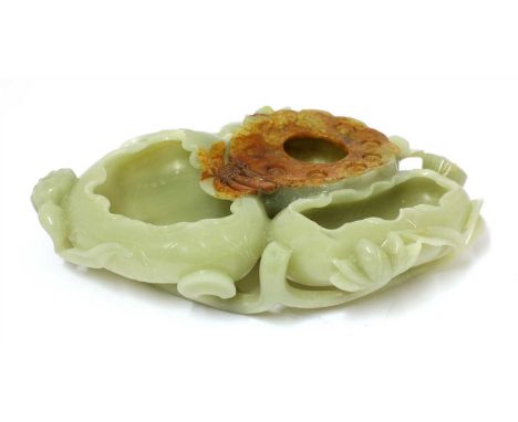 A Chinese jade brush washer, in the form of lotus leaves, flowers and pods, supported on stems, the stone of greyish-green to