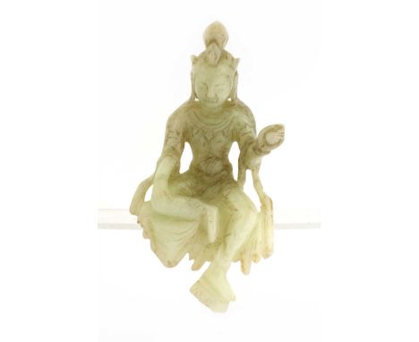 A Chinese jade bodhisattva, seated with his left foot resting on a lotus flower, his left hand raised, the stone of greyish-w