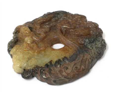 A Chinese jade bi disc, carved with an immortal battling a dragon above waves, the reverse with archaic scrolls, 7.5cm wide