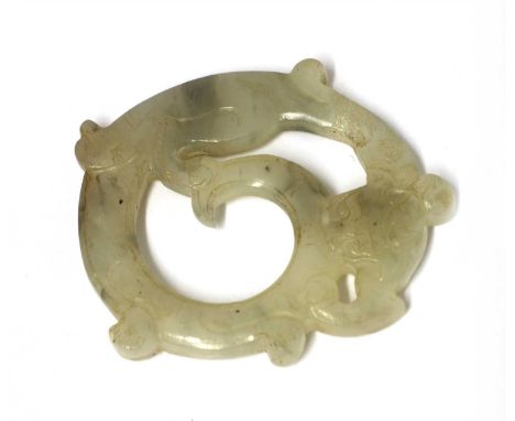 A Chinese jade pendant, of a chilong catching its tail in its mouth, the stone of greyish-white tone, 4.5cm diameter