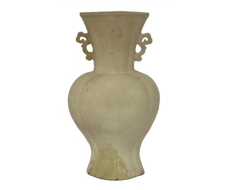 A Chinese Chaozhou ware vase, late Ming dynasty, of lobed baluster form with a flared mouth covered in a crackled cream glaze