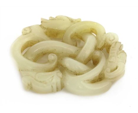 A Chinese jade carving, of two chilong and a phoenix entangled, the stone of greyish-white tone, 6cm wide