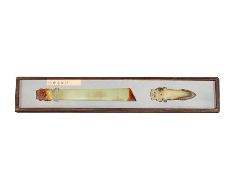 Two Chinese jade carvings, both in the shape of a blade, one carved with taotie , the stone of greyish-green tone, 26.8cm lon