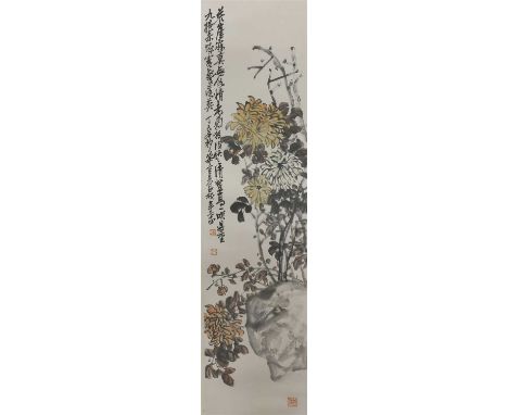 A Chinese hanging scroll, painted with chrysanthemums above a rock, inscribed and dated Year of Dingsi, signature of Wu Chang