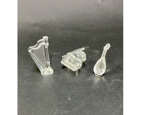 Swarovski Crystal Glass, three musical instruments, including a grand piano, a lute with stand and a harp. Three in total, no