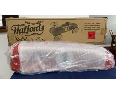 Halfords red racing car - Ride on toy. ‘Your little racer’s dream’. Metal body, rubber tyres &amp; chrome steering wheel.