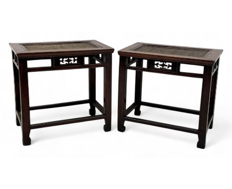 Pair of early 20th century Chinese hardwood side tables, each with rectangular woven cane top, pierced frieze with foliate mo