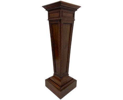 Edwardian mahogany pedestal stand, moulded square top on tapered pedestal decorated with blind fretwork, on stepped and mould