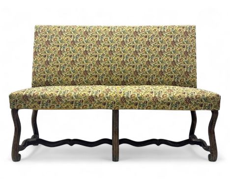 Early 20th century walnut framed bench, upholstered in floral tapestry fabric, raised on scrolled carved cabriole supports un