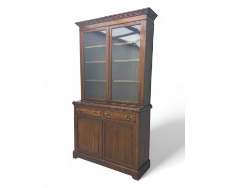 Edwardian walnut display cabinet, projecting moulded cornice over twin-glazed doors enclosing three shelves, base fitted with