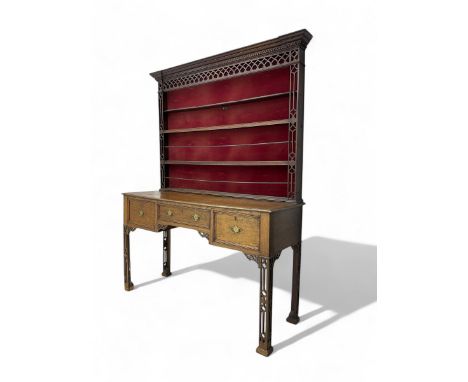 George III oak dresser, projecting cornice over fretwork frieze and three heights plate rack, fretwork uprights, moulded rect