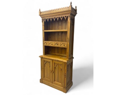 Late 19th century Gothic Revival pine dresser, the upper section with pierced cresting rail above open shelving and four smal