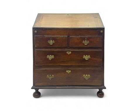 George III oak bureau, sloped fall-front enclosing a fitted interior with pigeonholes, small drawers, and a central compartme