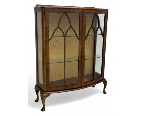 Early 20th century walnut bow-fronted display cabinet, enclosed by two astragal glazed doors, on cabriole feet Dimensions: He