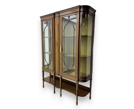 Edwardian inlaid mahogany display cabinet, projecting moulded cornice over two glazed doors, flanked by curved glazed sides a