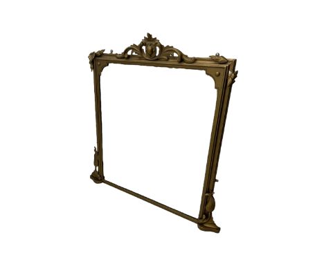 19th century gilt framed overmantel mirror, cartouche pediment surrounded by curling leaves, moulded framed enclosing plain m