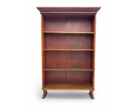 Early 20th century mahogany bookcase, projecting moulded cornice over four adjustable open shelves, raised on shaped bracket 