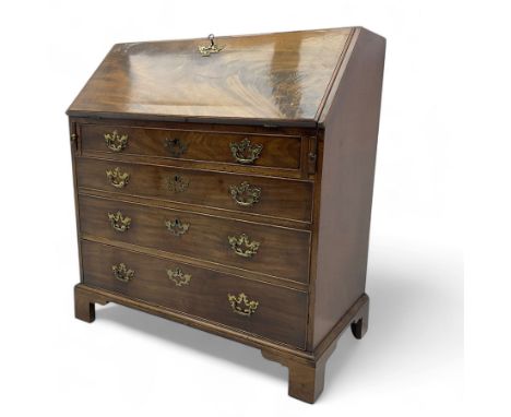 George III mahogany bureau, fall-front enclosing a fitted interior of drawers, pigeonholes and central mirrored cupboard, ove