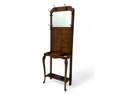 Early 20th century walnut hall stand, rectangular inset mirror above a veneered panel back with six metal coat hooks, central