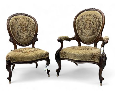 Pair of Victorian walnut lady's and gentleman's drawing room chairs, arched cresting rail carved with cartouche and extending