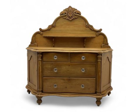 Late 19th century pine sideboard, acanthus carved pediment above a central shelf, serpentine front top, fitted with two short