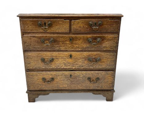 Small George III oak chest, moulded rectangular top over two short and three long drawers, on bracket feetDimensions: Height: