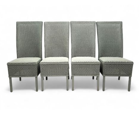 Set of four Lloyd Loom dining chairs, each with woven high back and seat in dove grey finish, raised on matching painted tubu