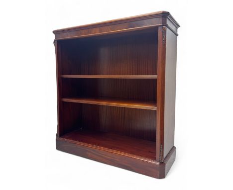 Early 20th century mahogany open bookcase, rectangular moulded top with chamfered corners, over two adjustable shelves flanke