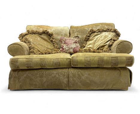 Contemporary two-seat sofa, upholstered in damask fabric with a pale gold floral pattern, rolled arms, loose back and seat cu