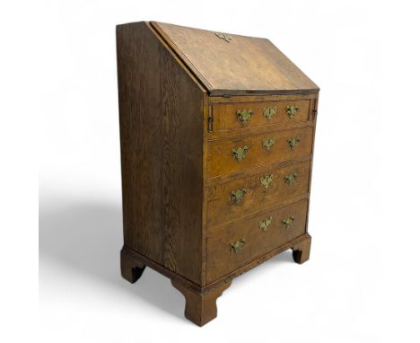 George III figured walnut bureau, fall-front enclosing central cupboard, six pigeonholes and six drawers, fitted with four gr