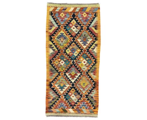 Chobi Kilim multicoloured ground runner, displaying diamond-shaped motifs in shades of blue, red, yellow, and green, accented