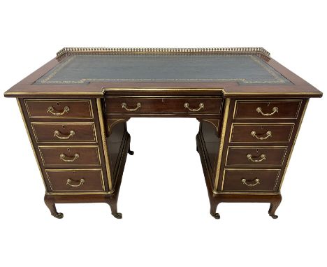 Edwardian walnut twin pedestal writing desk, moulded reverse break-front top with raised gallery and leather inset, fitted wi