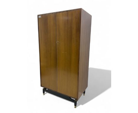 G-Plan - mid 20th century teak double wardrobe, set on a black painted base with brass-capped feetDimensions: Height:&nbsp;17