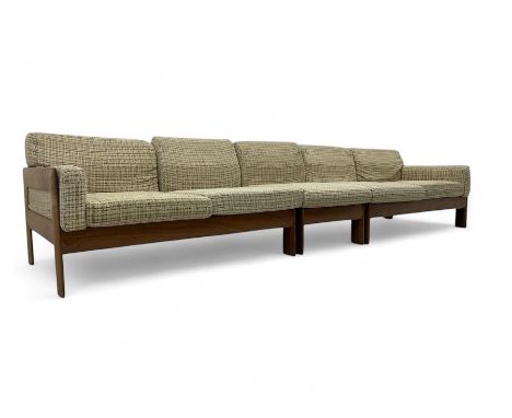 Mid-20th century modular five seater teak-framed sofa, each with padded seat and back cushions upholstered in beige checked f