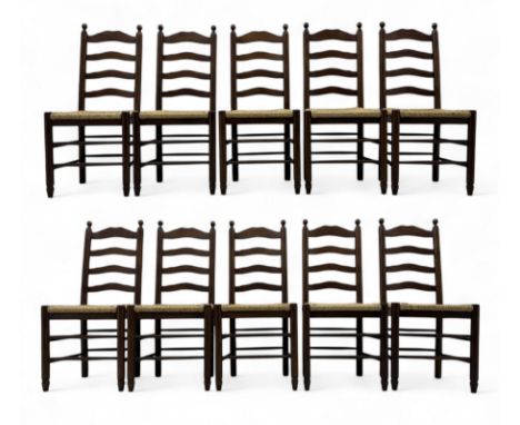 Set of ten 18th century design oak ladder back dining chairs, shaped cresting rail over four horizontal splats, rush seat rai