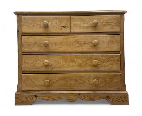 Pine chest, rectangular moulded top over four long drawers each with turned knob handles, on shaped plinth baseDimensions: He