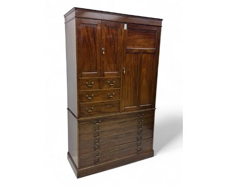 Late 19th to early 20th century mahogany combination wardrobe, the upper section fitted with two double cupboards, two short 