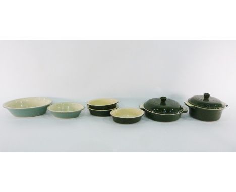 Collection of green and cream Le Creuset ceramic (stoneware) cookware including two lidded casseroles and oval pie dishes