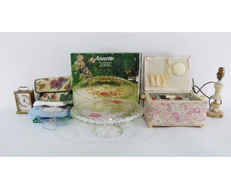 Moulded glass cake plate&nbsp;in original box, marked 'Annette', assorted prints, a sewing basket, a Tempora carriage clock, 