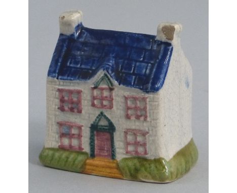 A pearlware money box, in the form of a double fronted cottage with Prattware style glazes, 6.5cm high