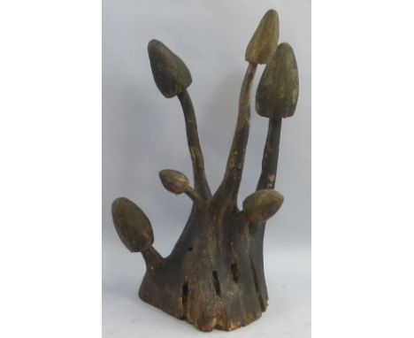 An oak garden sculpture by Malcolm MacLachlan, of Tibthorpe, East Yorkshire, carved from a single trunk in the form of a "mus
