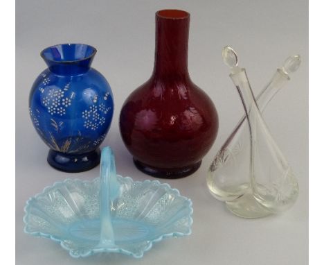 A ruby glass vase, of bottle shaped form moulded with drapes, 22cm high, a blue glass vase of bulbous form enamelled and gild