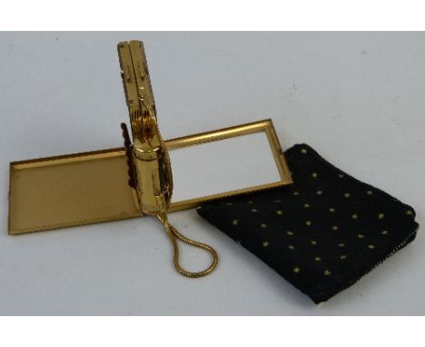 A Kigu gilt metal combined compact, cigarette case and lipstick holder, in the form of an engine turned evening bag, 8cm long