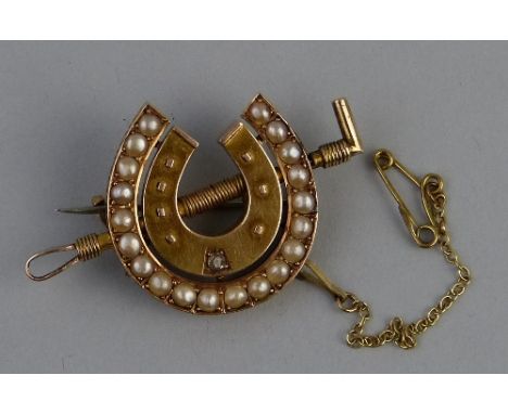 A Victorian 15ct gold seed pearl and diamond brooch, in the form of two concentric horseshoes and whip, the outer horseshoe s