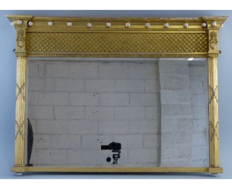 A 19th Century gilt overmantle mirror, of breakfast form with ball mounted concave cornice over a deep hatched frieze and obl