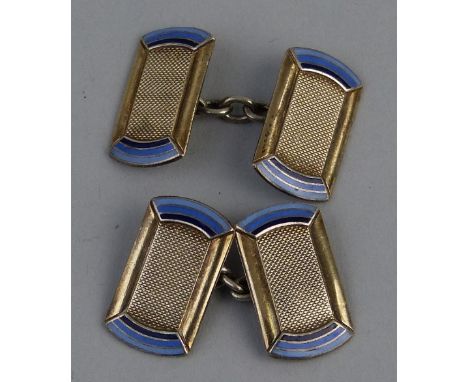 A pair of enamelled yellow and white metal cufflinks, having rounded oblong engine turned panels with blue shaded enamel, 2cm