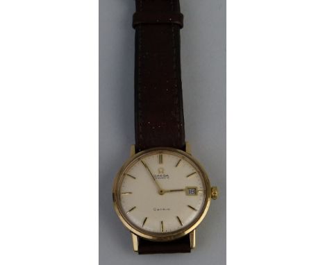 A gentleman's wristwatch by Omega, the automatic movement with champagne coloured circular dial having centre sweep seconds a