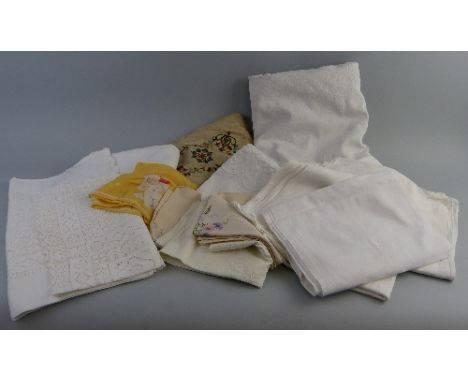 A Victorian Jacquard woven white linen bedspread, with central oblong panel of scrolling motifs, 255cm x 217cm, together with